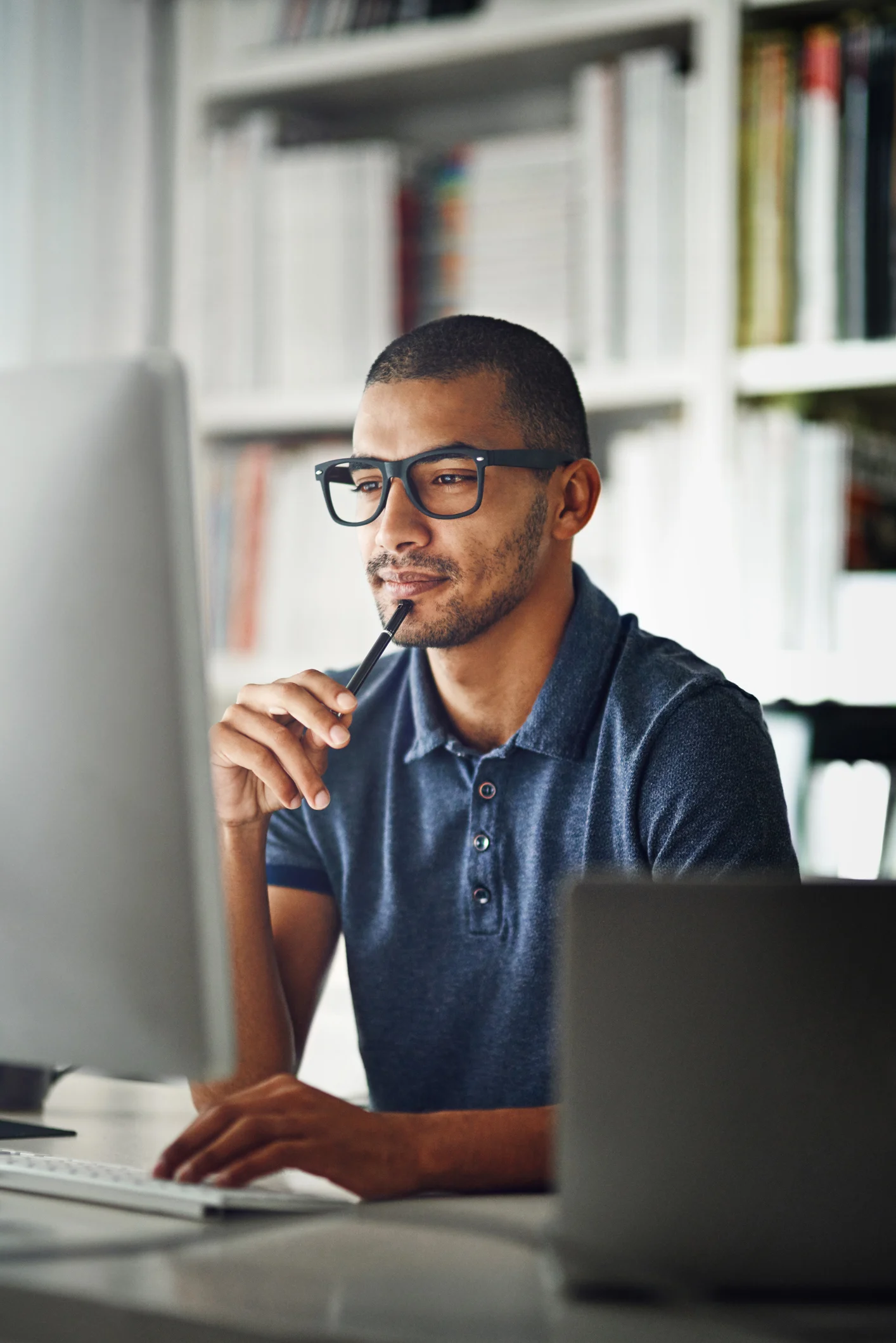 Person working at a computer in an office environment.