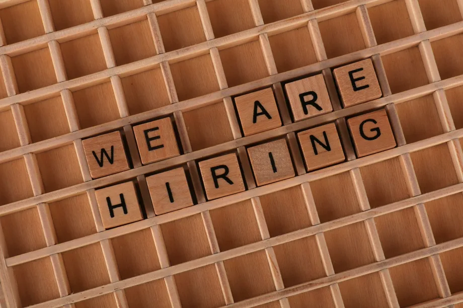 Wooden letters spelling “We are hiring”, the message every job ad has to make credible.